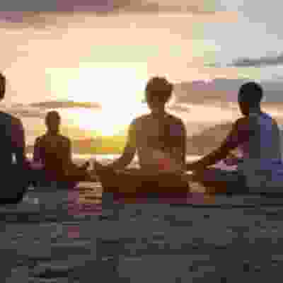 Watch the sunset during a beach yoga session on Playa Carillo