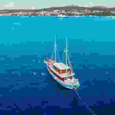 Boat sailing through the blue seas of Split,