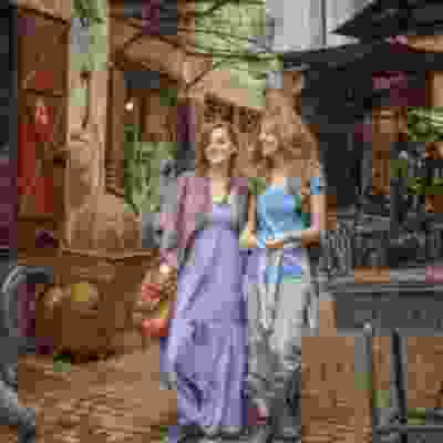 Two women travellers exploring Marrakech's souks.