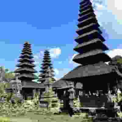 Three stone structure temples of Taman Ayun on a sunny day.