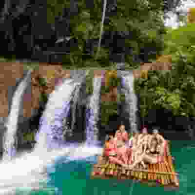 Group of travellers on a bamboo raft at Cambugahay falls.