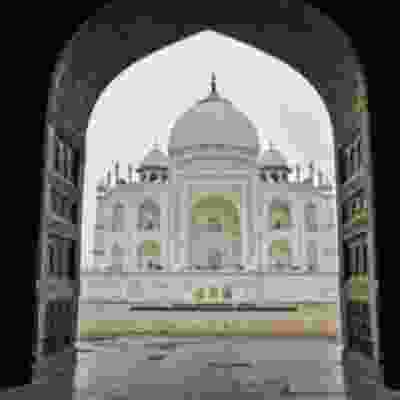 The view of Taj Mahal through archway.