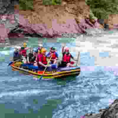 Group of travellers water rafting down Pacuare river.