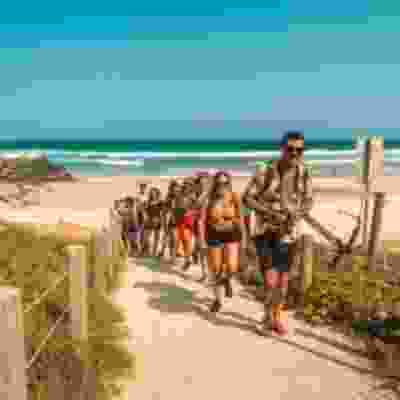 Tour group leaving Noosa Beach, Australia. 