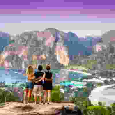 Three travellers standing at the Phi Phi viewpoint.