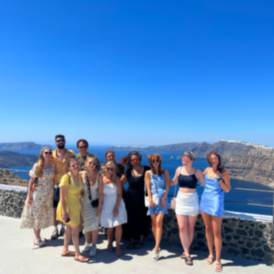 Group photo overlooking the coast of Santorini.