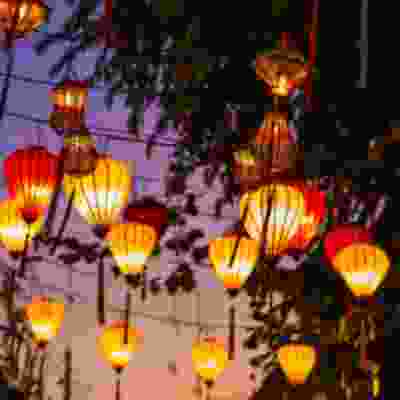 Arrive in the lantern-lit streets of Hoi An