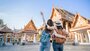 Two travellers looking over Thailand temple 